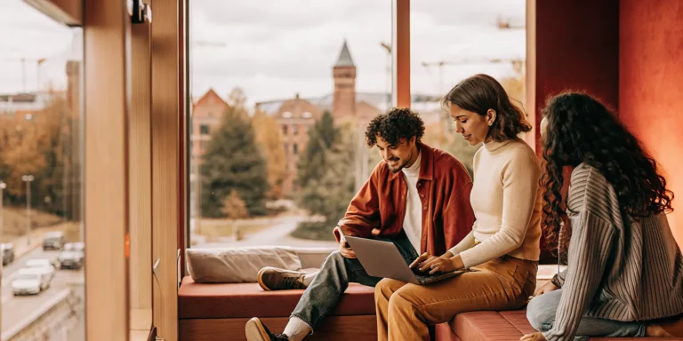International student housing leasing team reviewing digital applications