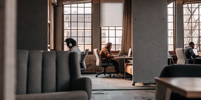 Modern student housing study lounge with natural light and ergonomic seating