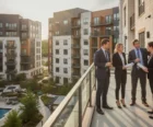 Property management team and investor reviewing a modern multifamily portfolio {{brizy_dc_image_alt entityId=