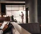 Property management professional reviewing data on a tablet in a modern apartment leasing office {{brizy_dc_image_alt entityId=